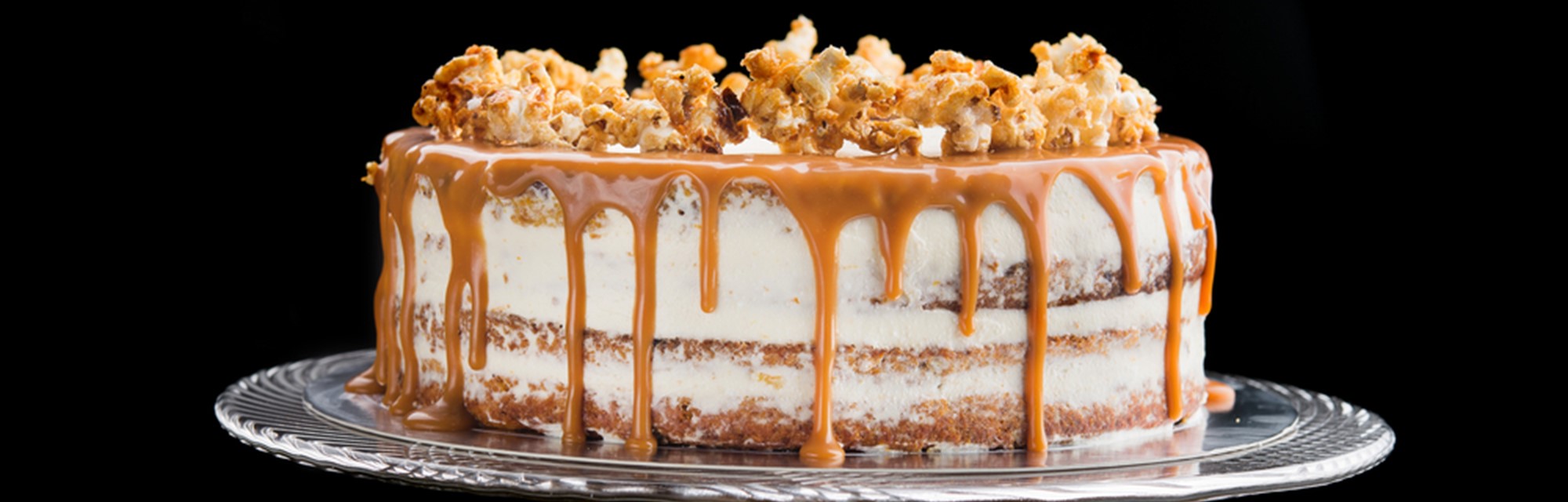 Two-layer chocolate popcorn cake with toffee sauce