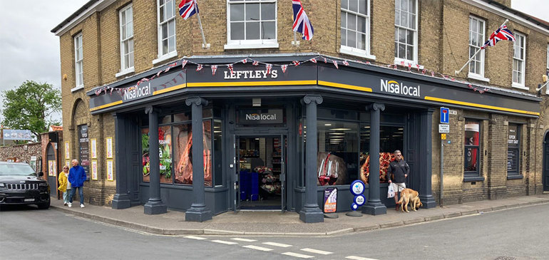 Celebrating half a century in Norfolk front of store with Nisa fascia