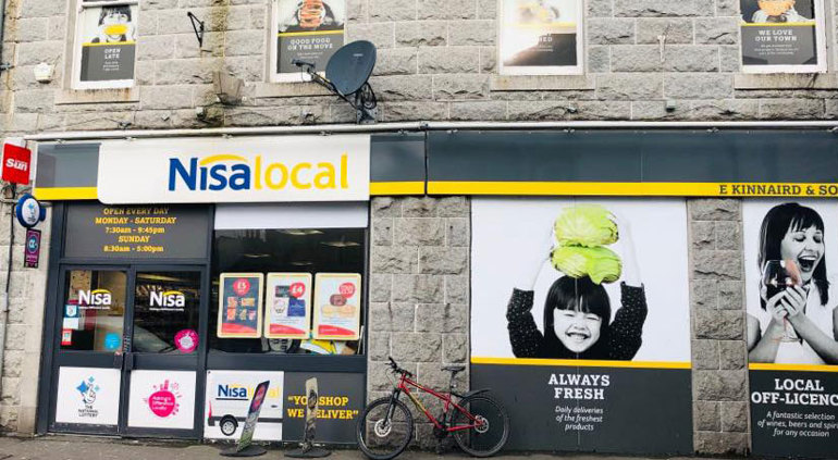 Celebrating a century satisfying shoppers store front fascia