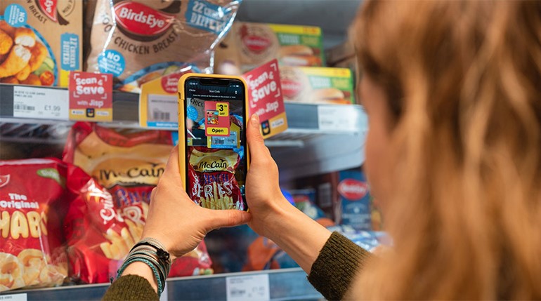 Nisa doubles their stores offering jisp’s scan & save close up of app and scanning labels in store