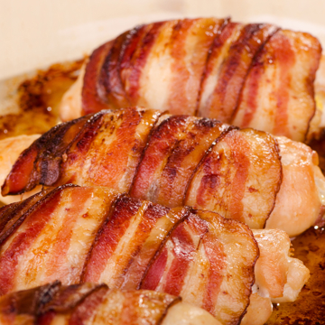 Cheese-stuffed chicken wrapped in bacon