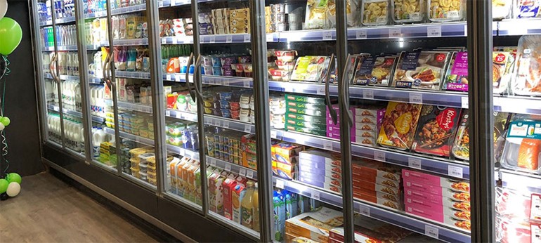 Nisa partner in Surrey reopens village store after devastating fire fully stocked fridges and freezers