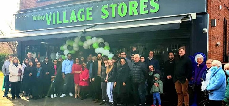 Nisa partner in Surrey reopens village store after devastating fire front of store opening with fascia